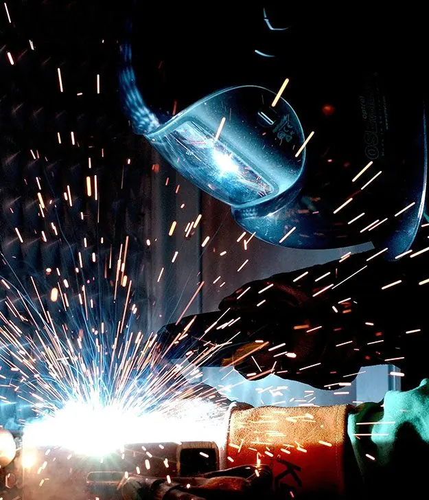 Steel cutting with sparks in the workshop